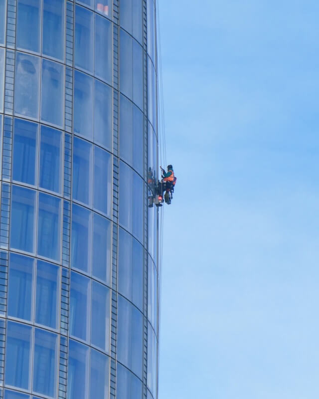 Window washing a high-rise in Chicago, Illinois for a high-rise commercial cleaning client